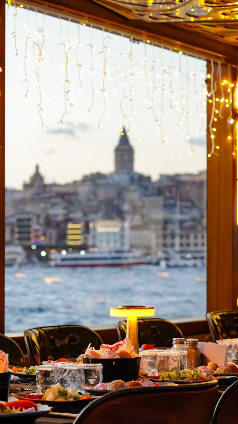 A laid table by the window with Galata beyond