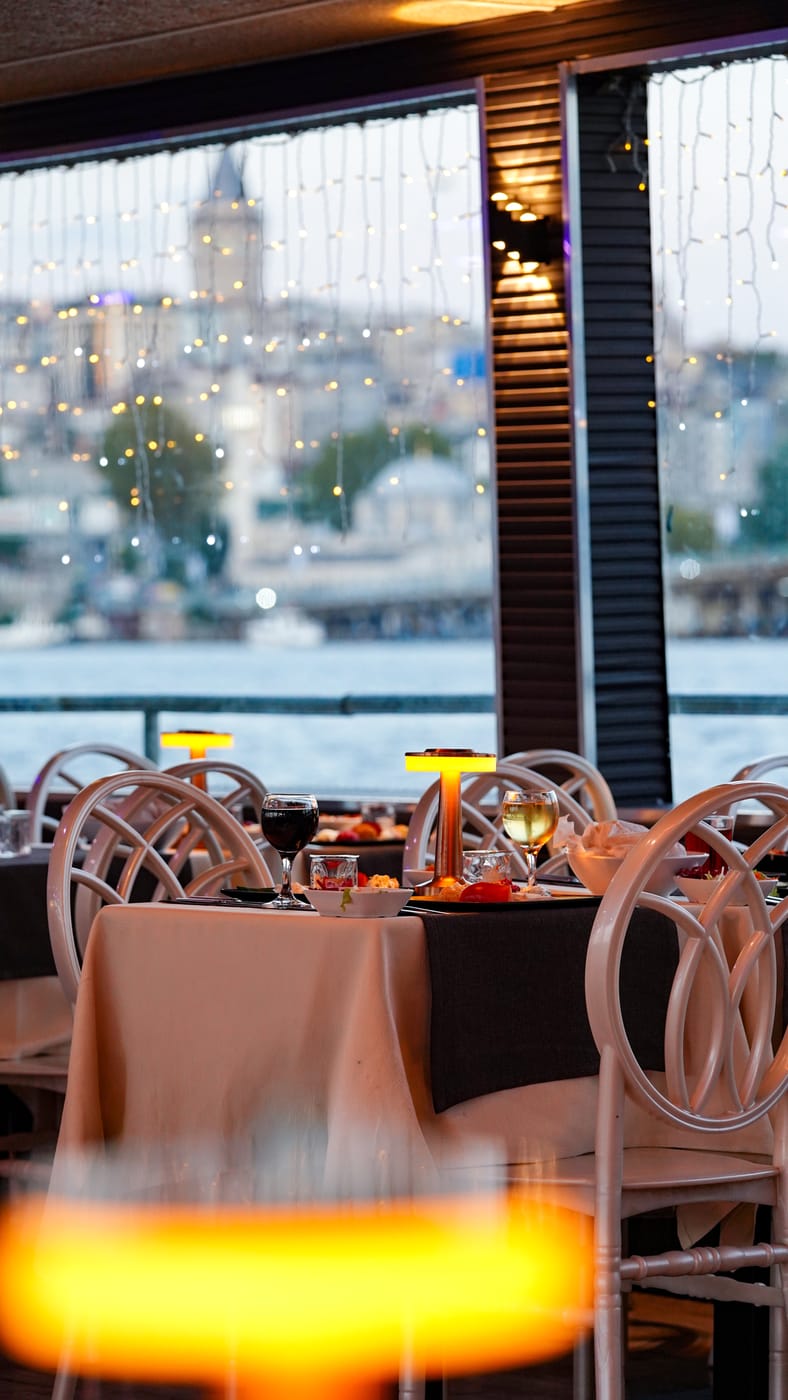 A laid table by the window with Galata beyond