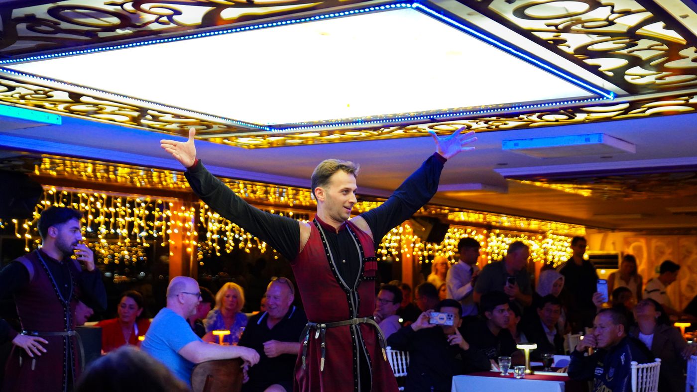 A soloist opens his arms to the room