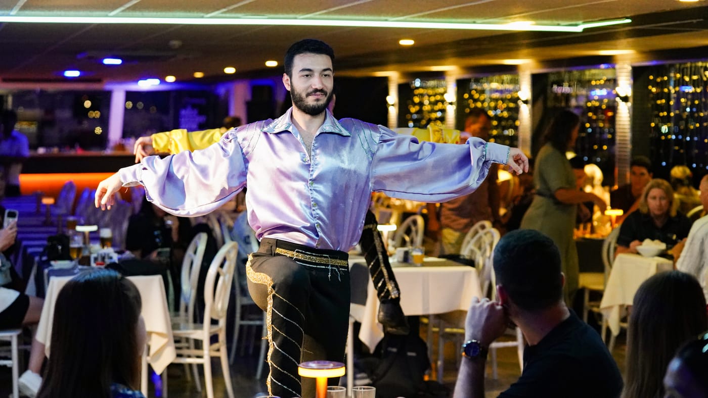 A soloist opens his arms to the room