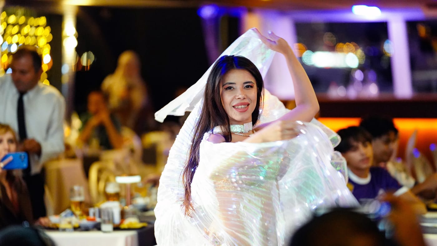 Belly dancer with illuminated veil wings