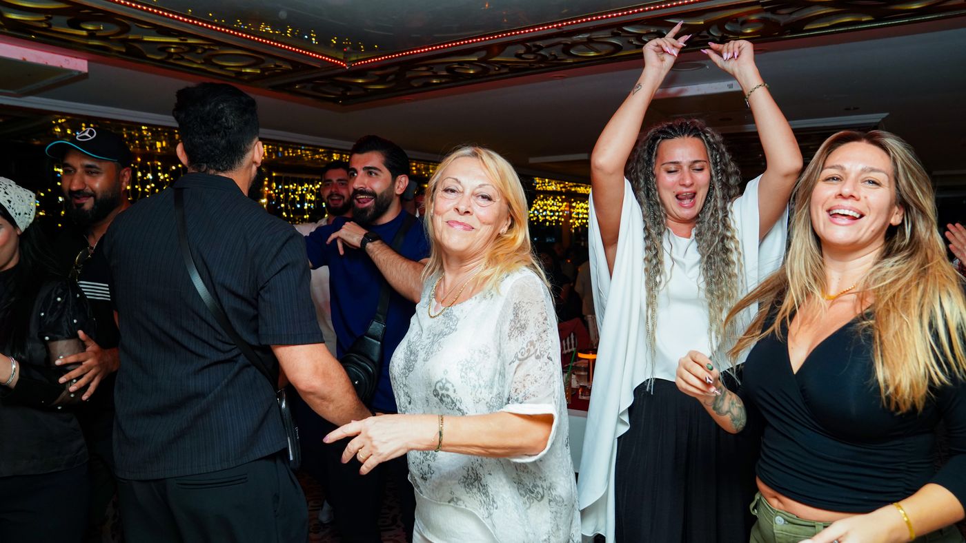 Friends dance together after the show