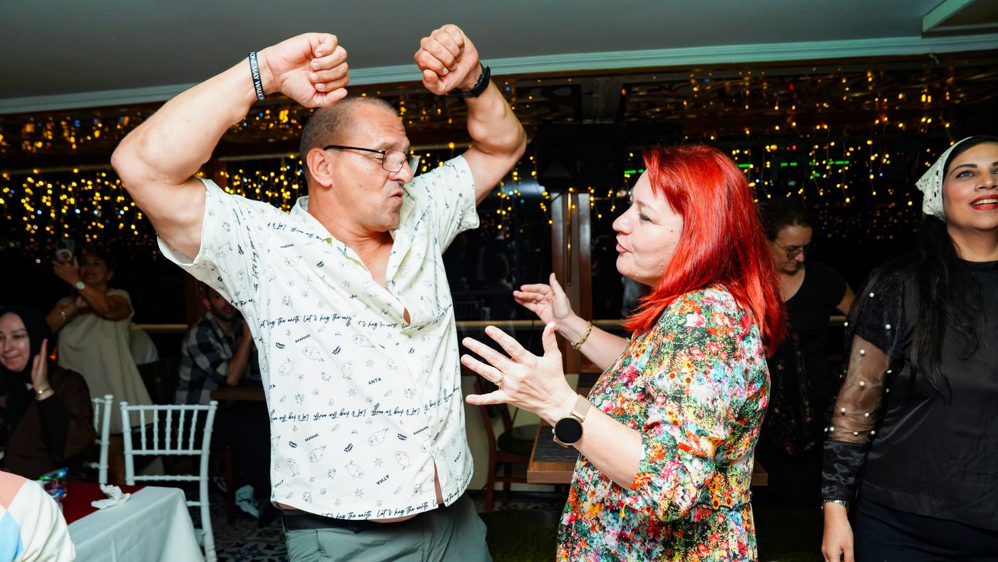 A guest dances as the DJ set builds