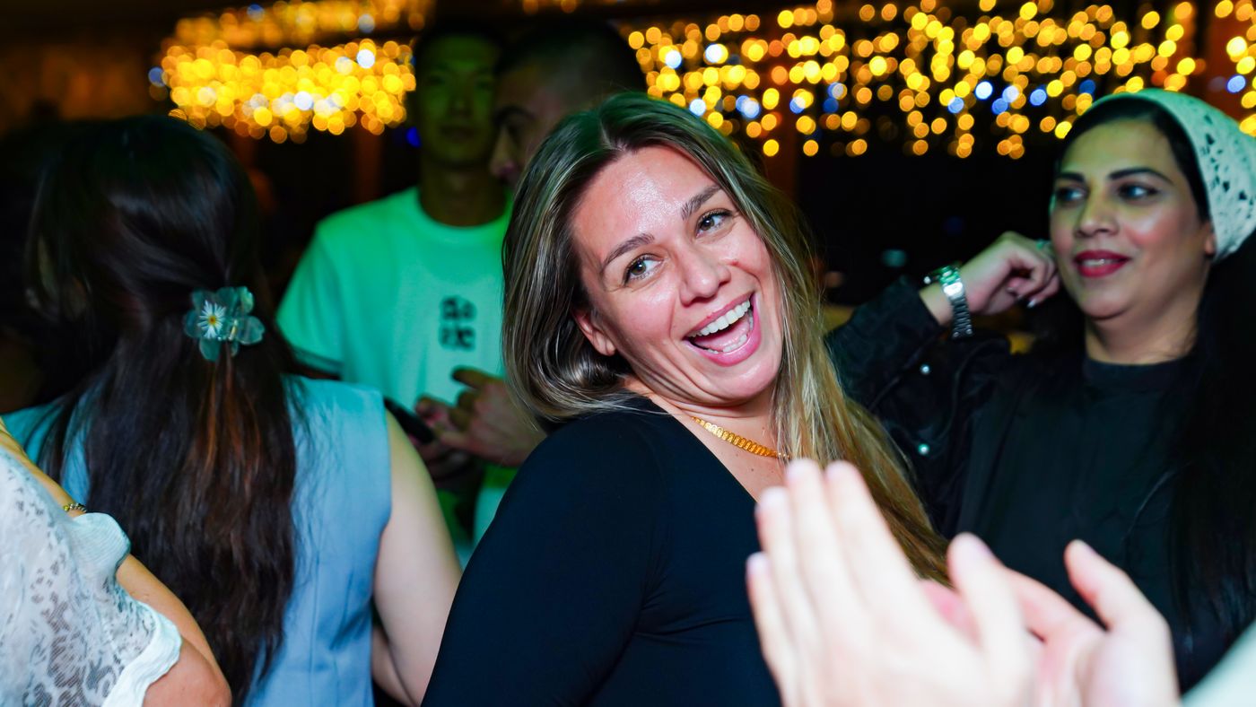 Laughter on the crowded dance floor