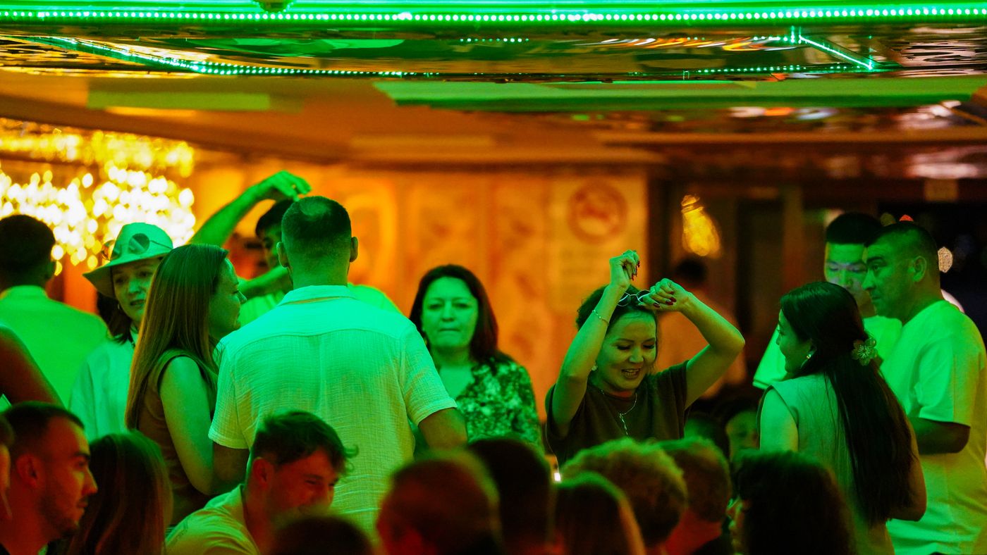 The dance floor under green party lights