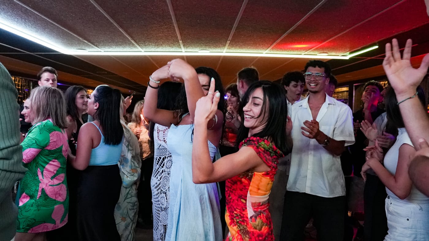Laughter on the crowded dance floor
