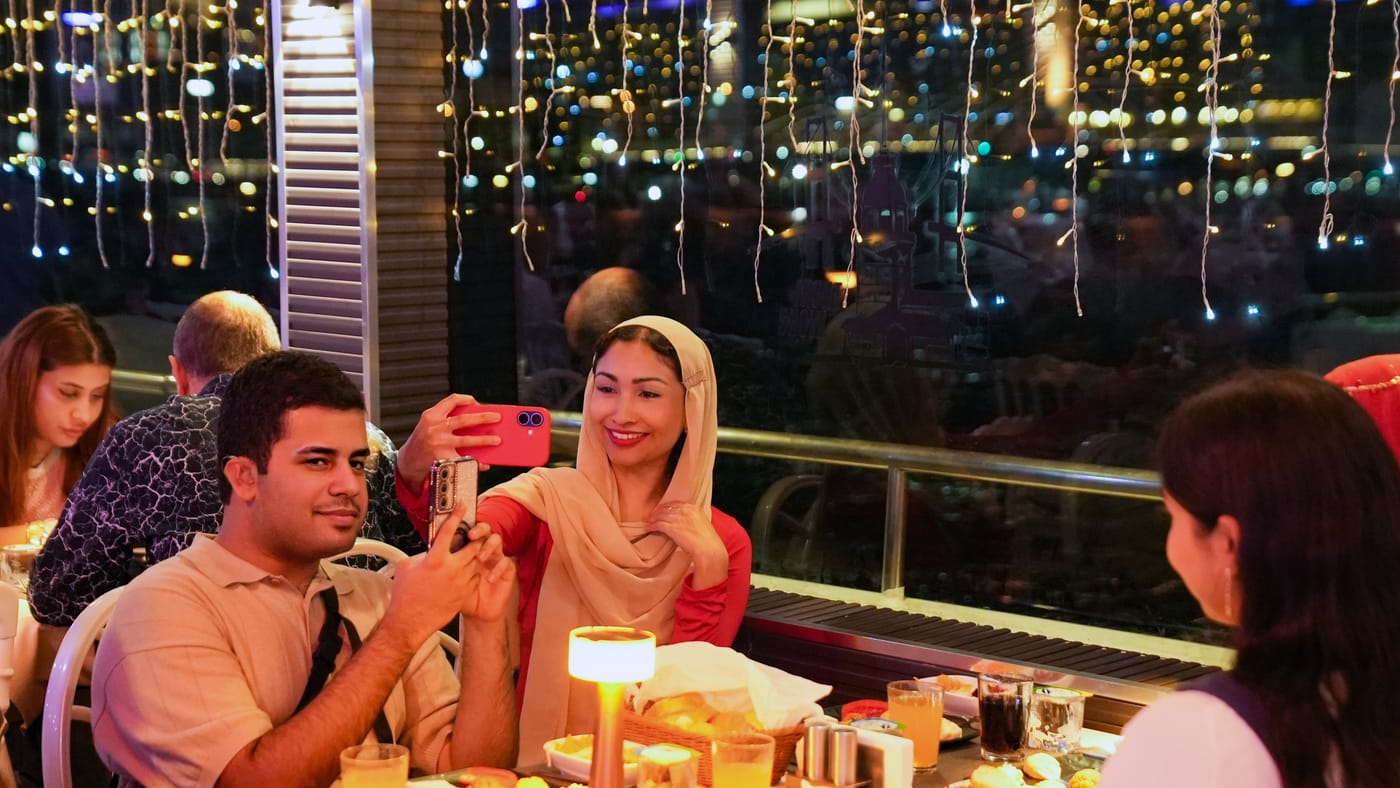 A selfie at the window table, phone in hand
