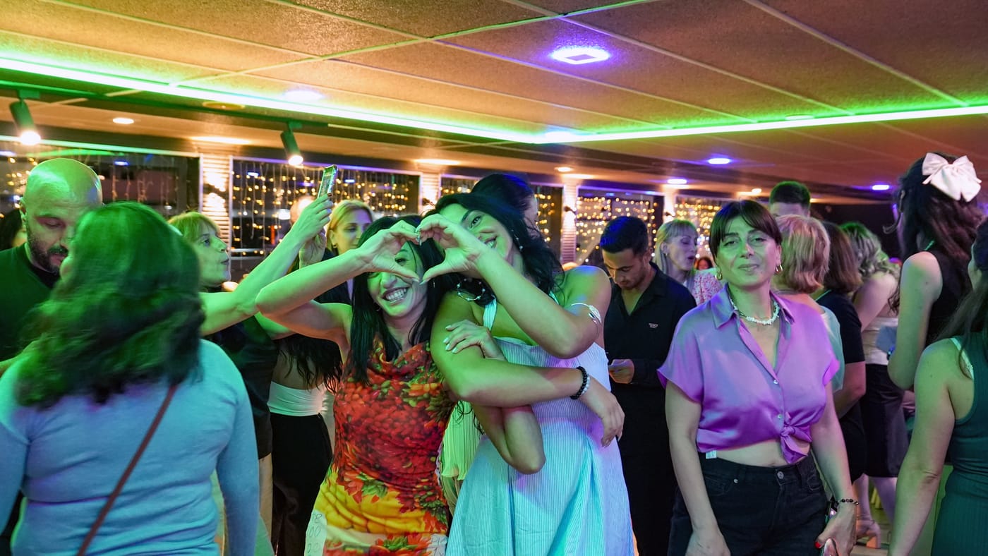The dance floor under green party lights