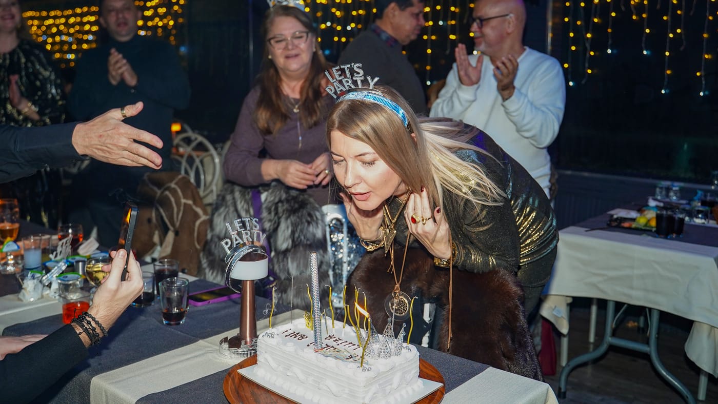 Blowing out the candles on the celebration cake