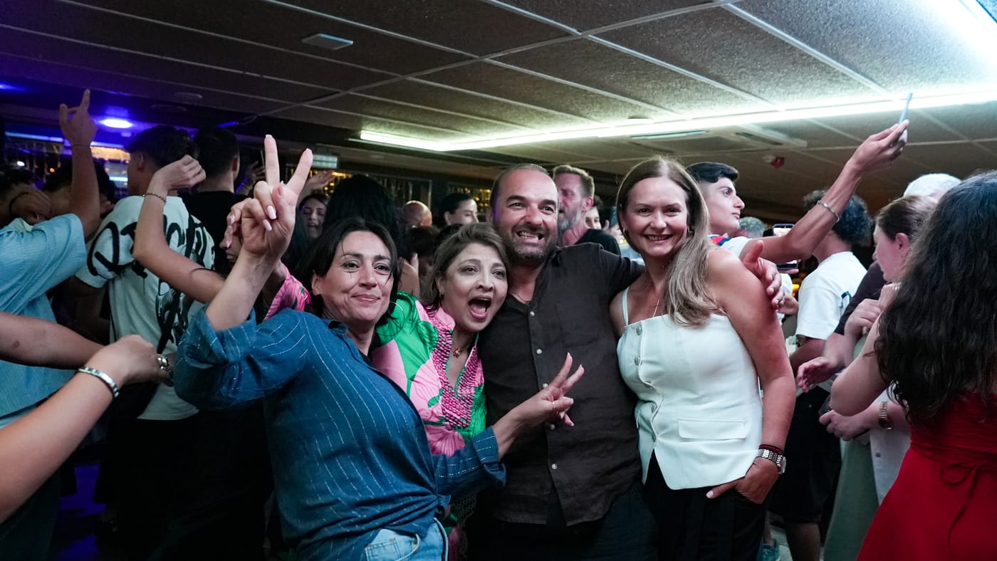 Friends dance together after the show