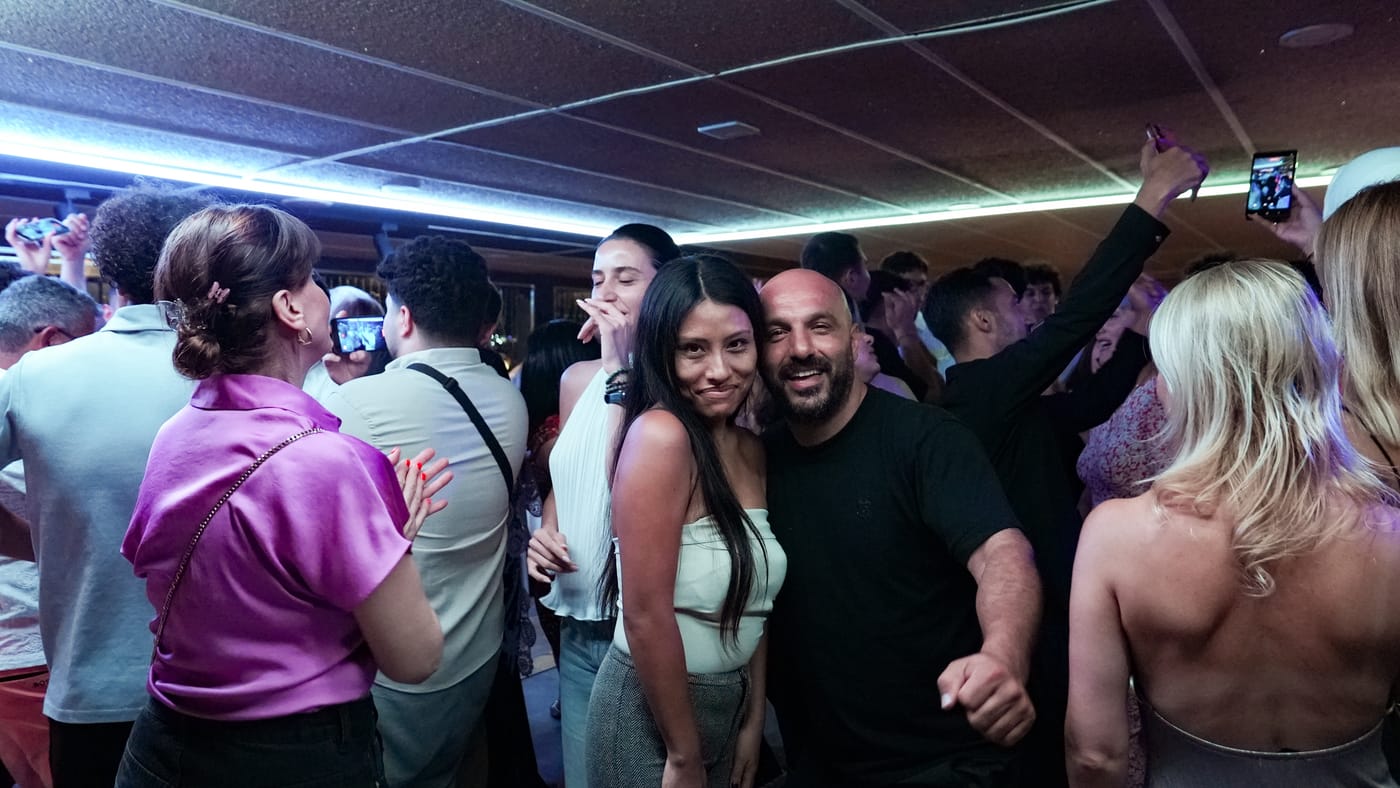Posing for a photo on the crowded dance floor