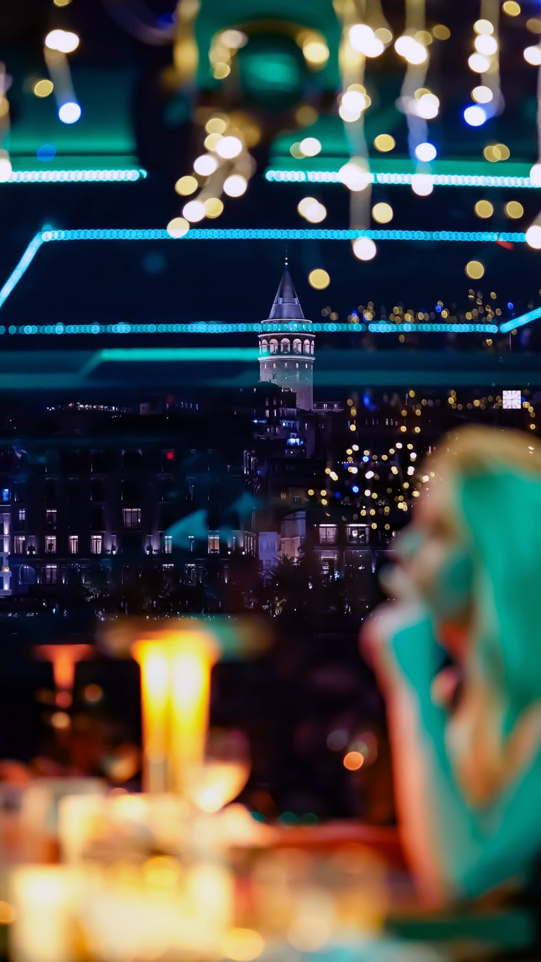Galata Tower through the salon glass at night