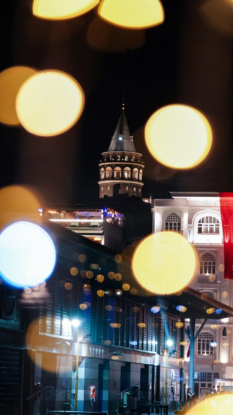 Galata Tower through the salon glass at night